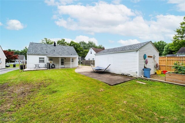 162 N Beverly Ave, Youngstown, OH 44515 - rear view of house featuring a patio, an outdoor structure, and a garden