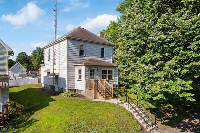 274 2nd St SW, Brewster, OH 44613 - back of house featuring a chimney