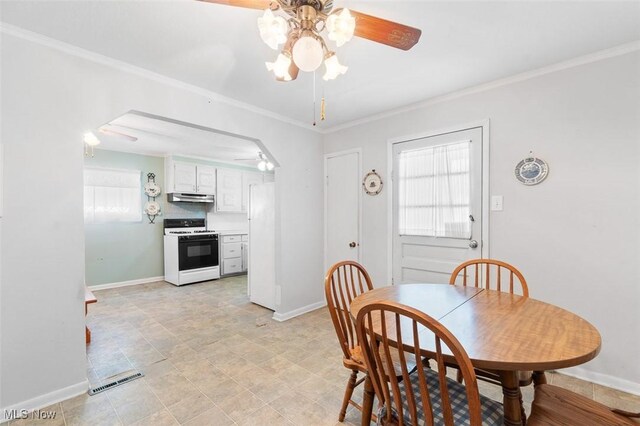 274 2nd St SW, Brewster, OH 44613 - dining room featuring ceiling fan and crown molding