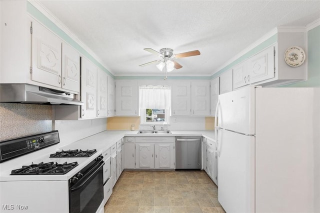 274 2nd St SW, Brewster, OH 44613 - kitchen featuring freestanding refrigerator, gas range oven, under cabinet range hood, stainless steel dishwasher, and ceiling fan