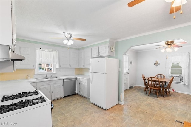 274 2nd St SW, Brewster, OH 44613 - kitchen featuring white appliances, a ceiling fan, ornamental molding, arched walkways, and light countertops