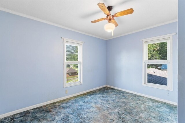 274 2nd St SW, Brewster, OH 44613 - carpeted empty room featuring healthy amount of natural light, ornamental molding, and ceiling fan