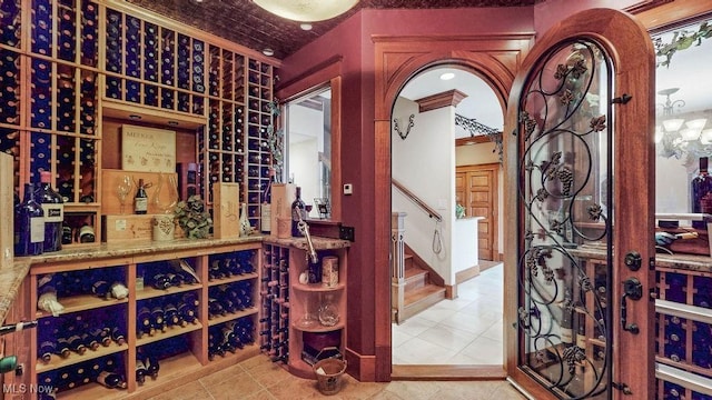 1431 Cedar Point Rd, Sandusky, OH 44870 - wine cellar featuring tile patterned floors and crown molding