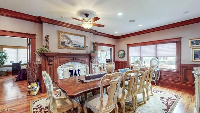 1431 Cedar Point Rd, Sandusky, OH 44870 - dining space featuring crown molding, a wainscoted wall, ceiling fan, plenty of natural light, and light wood finished floors