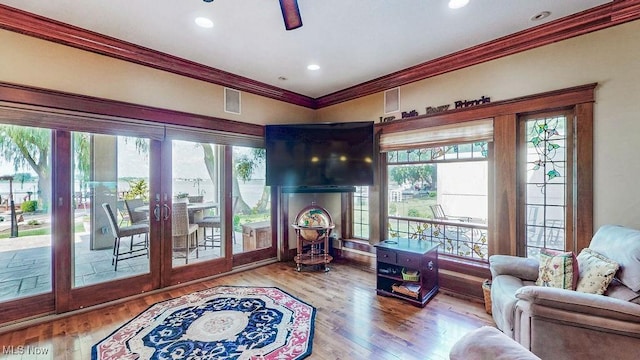 1431 Cedar Point Rd, Sandusky, OH 44870 - living room featuring crown molding, wood finished floors, french doors, and recessed lighting