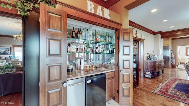 1431 Cedar Point Rd, Sandusky, OH 44870 - indoor wet bar featuring dishwasher, crown molding, light wood-style floors, stainless steel built in refrigerator, and recessed lighting