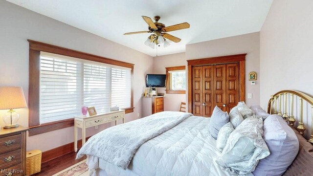 1431 Cedar Point Rd, Sandusky, OH 44870 - bedroom with wood finished floors, a ceiling fan, and a closet