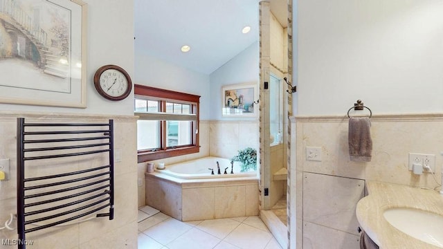 1431 Cedar Point Rd, Sandusky, OH 44870 - full bathroom featuring a garden tub, vaulted ceiling, vanity, a shower stall, and a towel warming rack