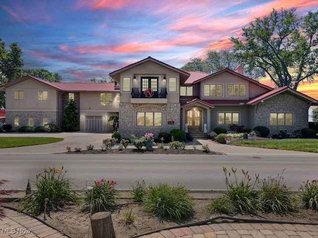 1431 Cedar Point Rd, Sandusky, OH 44870 - view of front facade with stone siding, stucco siding, and a balcony