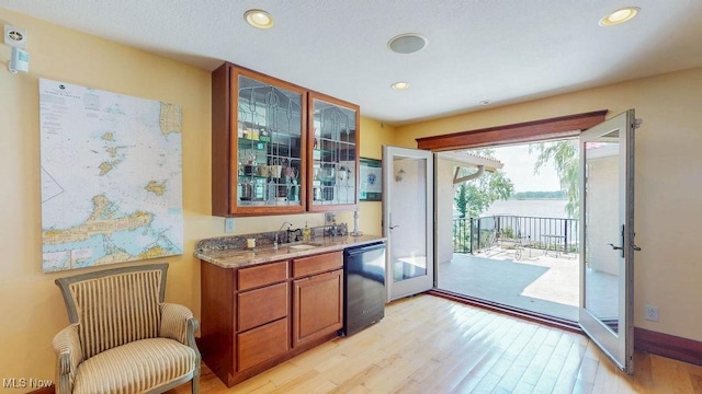 1431 Cedar Point Rd, Sandusky, OH 44870 - indoor wet bar featuring light wood finished floors, black dishwasher, and recessed lighting