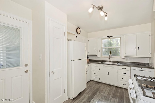 2215 S Belvoir Blvd, University Heights, OH 44118 - kitchen featuring white appliances, dark countertops, white cabinetry, dark wood-type flooring, and backsplash