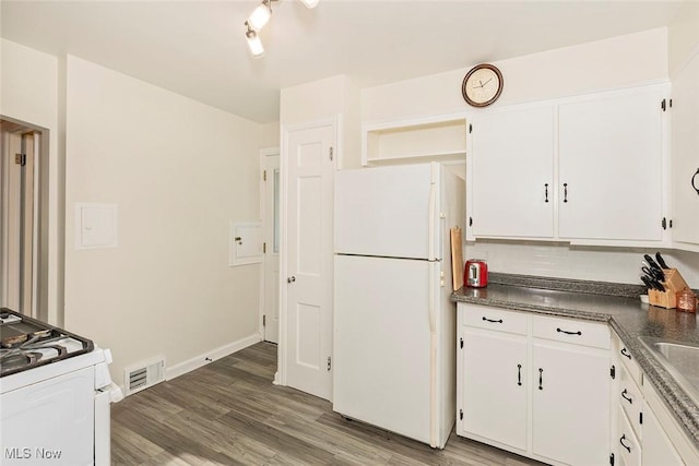2215 S Belvoir Blvd, University Heights, OH 44118 - kitchen featuring white appliances, white cabinetry, wood finished floors, and dark countertops