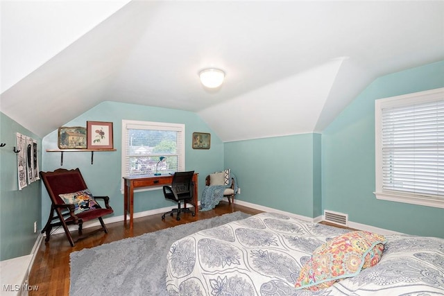 2215 S Belvoir Blvd, University Heights, OH 44118 - bedroom with vaulted ceiling and wood finished floors