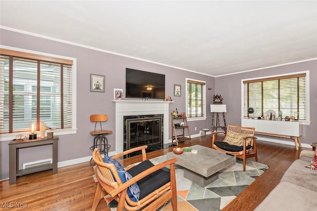 2215 S Belvoir Blvd, University Heights, OH 44118 - living room featuring wood finished floors, a premium fireplace, and crown molding