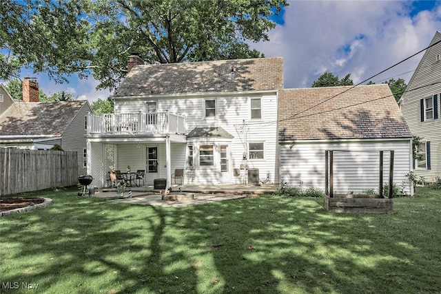 2215 S Belvoir Blvd, University Heights, OH 44118 - rear view of property featuring a patio area, a balcony, and a chimney