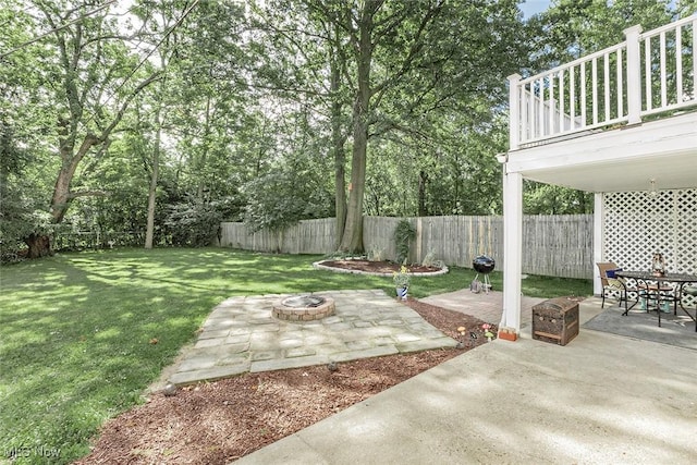 2215 S Belvoir Blvd, University Heights, OH 44118 - fenced backyard with an outdoor fire pit and a patio