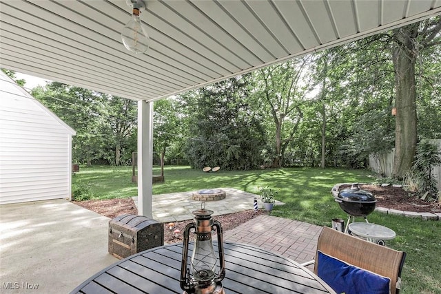 2215 S Belvoir Blvd, University Heights, OH 44118 - fenced backyard featuring a fire pit, a patio area, view of scattered trees, and outdoor dining area
