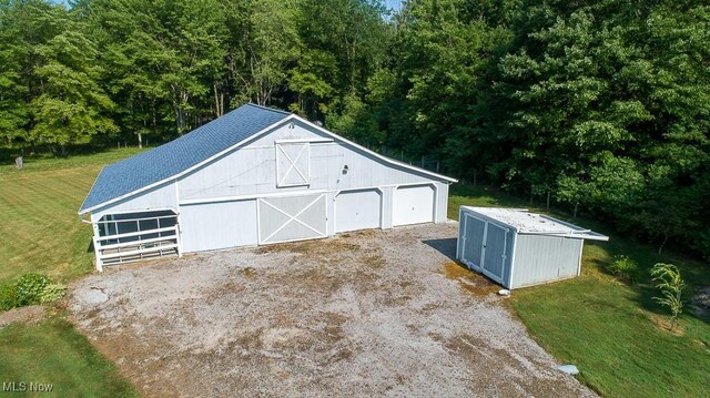 11919 Claridon Troy Rd, Chardon, OH 44024 - detached garage with a wooded view