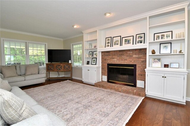 11919 Claridon Troy Rd, Chardon, OH 44024 - living area featuring crown molding, dark wood-style floors, a fireplace, and built in shelves