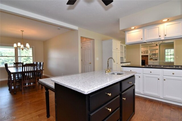 11919 Claridon Troy Rd, Chardon, OH 44024 - kitchen featuring white cabinets, dark wood finished floors, a kitchen island with sink, ceiling fan, and a chandelier