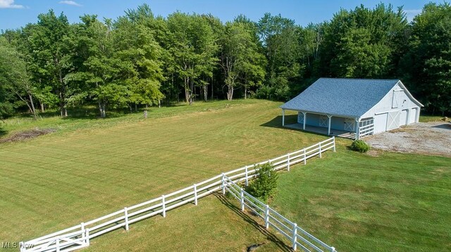 11919 Claridon Troy Rd, Chardon, OH 44024 - view of yard featuring an outdoor structure, a barn, and a detached garage