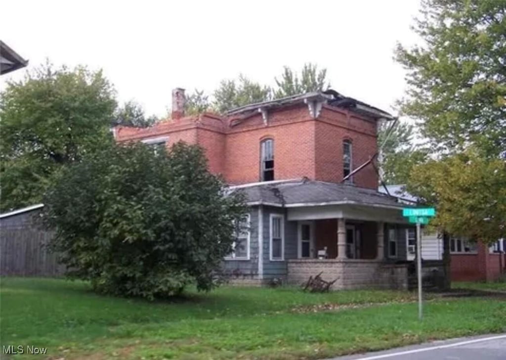 411 E Lima St, Forest, OH 45843 - view of property exterior with a chimney