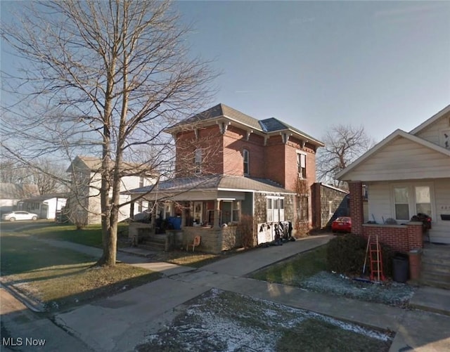 411 E Lima St, Forest, OH 45843 - italianate house with a porch and a front yard