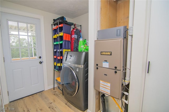 208 Jefferson Blvd, Mingo Junction, OH 43938 - laundry room featuring washer / clothes dryer and wood finished floors