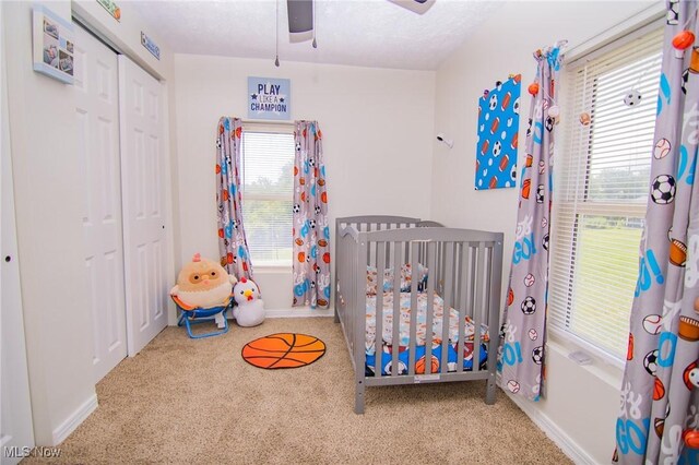 208 Jefferson Blvd, Mingo Junction, OH 43938 - carpeted bedroom with a crib, a closet, and ceiling fan