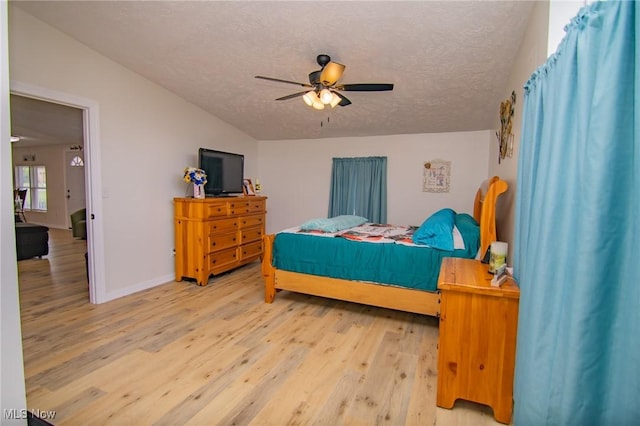 208 Jefferson Blvd, Mingo Junction, OH 43938 - bedroom featuring light wood finished floors, a textured ceiling, a ceiling fan, and vaulted ceiling