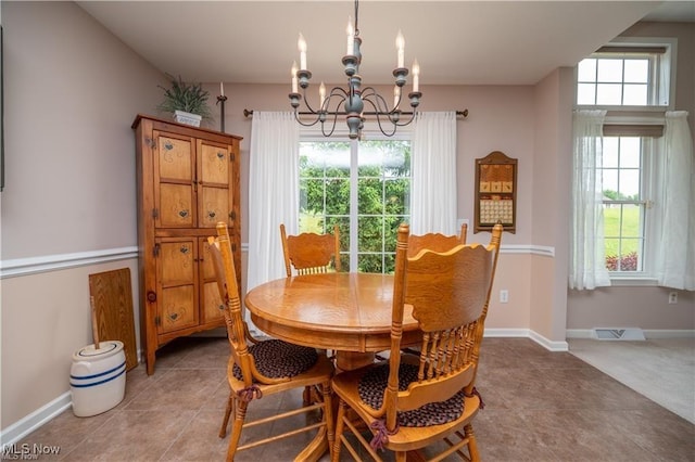 125 Fitch Blvd Unit 263, Austintown, OH 44515 - tiled dining room featuring a chandelier and baseboards