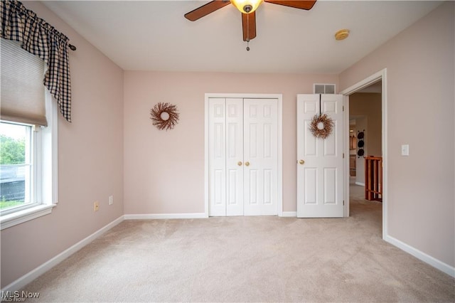 125 Fitch Blvd Unit 263, Austintown, OH 44515 - unfurnished bedroom featuring light carpet, a closet, and a ceiling fan