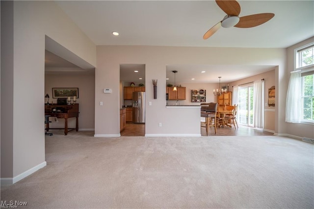 125 Fitch Blvd Unit 263, Austintown, OH 44515 - living room with light colored carpet, ceiling fan, recessed lighting, and a chandelier