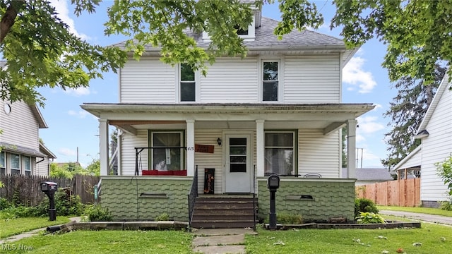 415 N Columbus St, Crestline, OH 44827 - american foursquare style home featuring covered porch and roof with shingles