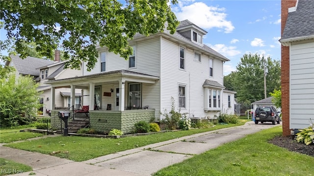 415 N Columbus St, Crestline, OH 44827 - traditional style home with covered porch and a front lawn