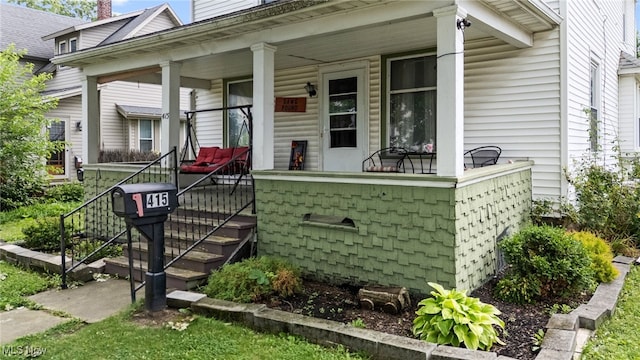415 N Columbus St, Crestline, OH 44827 - property entrance featuring a porch