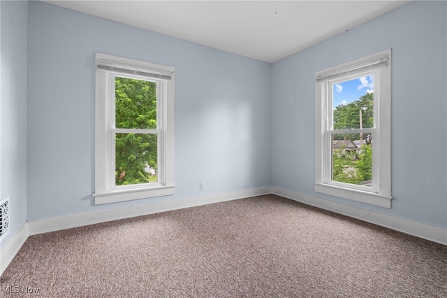 415 N Columbus St, Crestline, OH 44827 - carpeted spare room featuring healthy amount of natural light