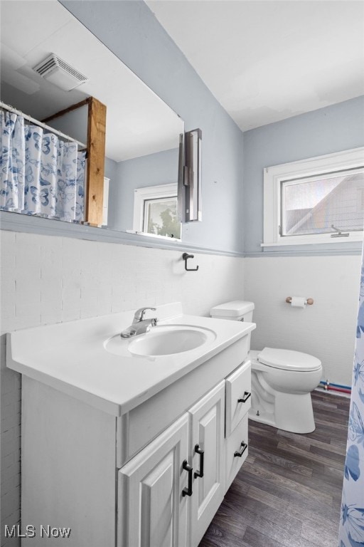 415 N Columbus St, Crestline, OH 44827 - full bathroom with vanity, wood finished floors, and a shower with shower curtain