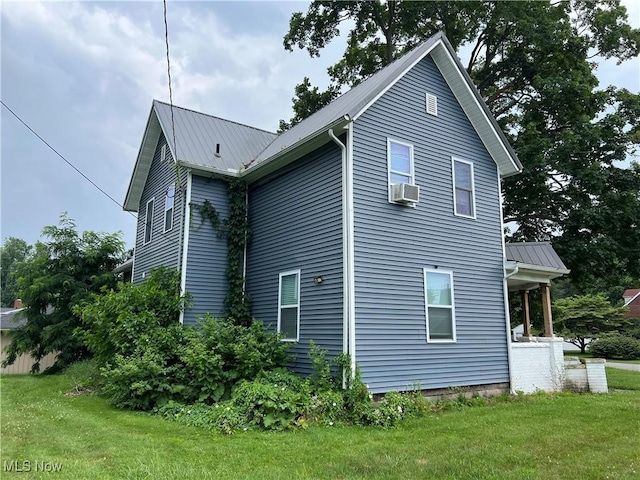 45055 N Ridge Rd, Amherst, OH 44001 - view of side of property featuring a lawn and a metal roof