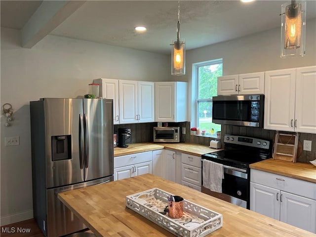 45055 N Ridge Rd, Amherst, OH 44001 - kitchen featuring wood counters, appliances with stainless steel finishes, white cabinetry, backsplash, and recessed lighting