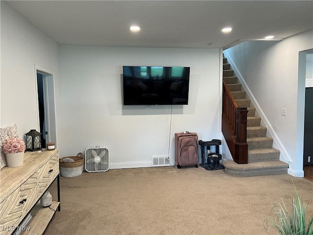 45055 N Ridge Rd, Amherst, OH 44001 - living room with stairway, carpet flooring, and recessed lighting
