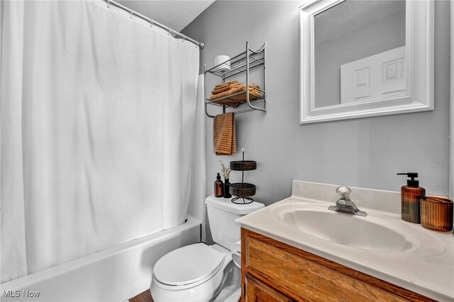 12208 State Route 113, Wakeman, OH 44889 - full bathroom featuring vanity, shower / bath combination with curtain, and a textured ceiling