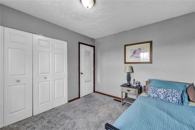 12208 State Route 113, Wakeman, OH 44889 - carpeted bedroom with a closet and a textured ceiling