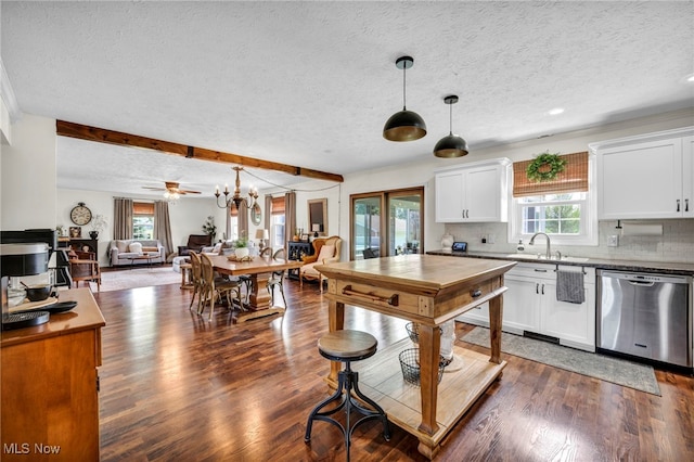 12208 State Route 113, Wakeman, OH 44889 - kitchen featuring dishwasher, a textured ceiling, open floor plan, dark wood-style floors, and white cabinetry
