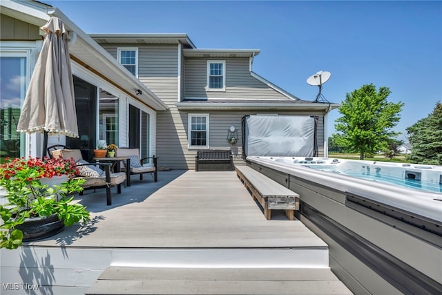 12208 State Route 113, Wakeman, OH 44889 - back of property with a covered hot tub and a deck