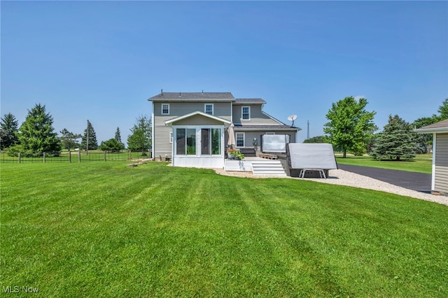 12208 State Route 113, Wakeman, OH 44889 - rear view of house with a sunroom