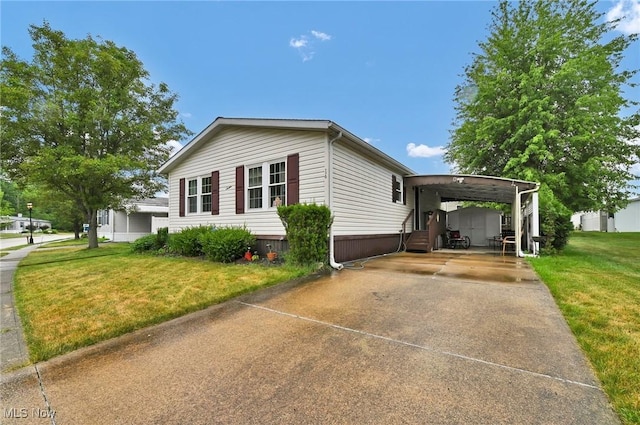 16 Piccolo, Olmsted Twp, OH 44138 - view of front of property with concrete driveway, a front lawn, and an attached carport