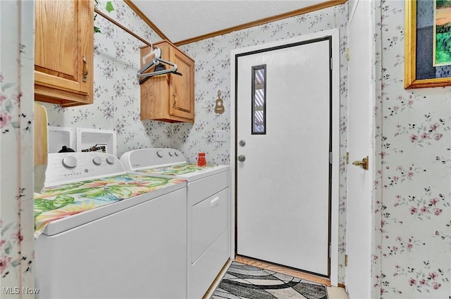16 Piccolo, Olmsted Twp, OH 44138 - laundry room featuring wallpapered walls, washing machine and clothes dryer, cabinet space, and ornamental molding