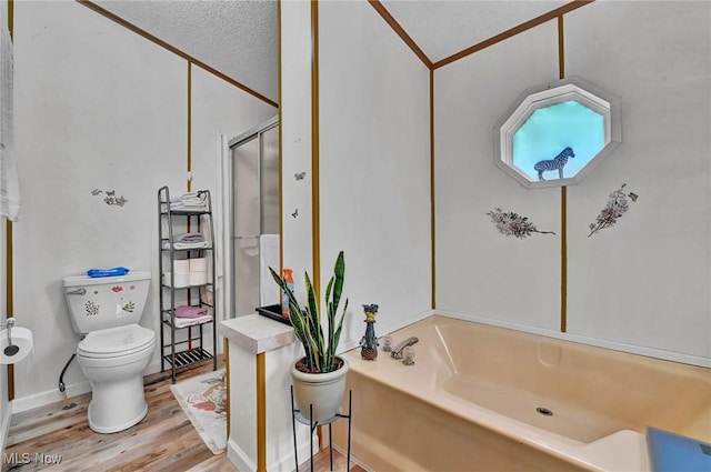 16 Piccolo, Olmsted Twp, OH 44138 - bathroom featuring wood finished floors, a garden tub, and a stall shower
