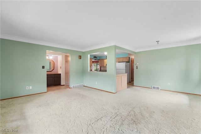 4899 Autumn Ln, Brooklyn, OH 44144 - unfurnished living room featuring crown molding and light colored carpet